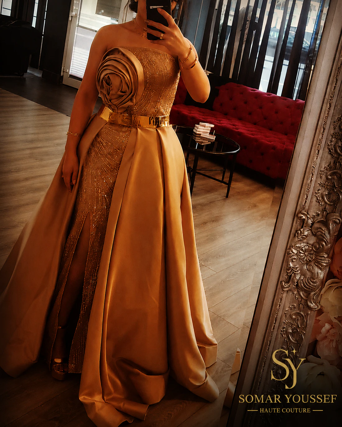Gold evening gown with sculptural rose detail